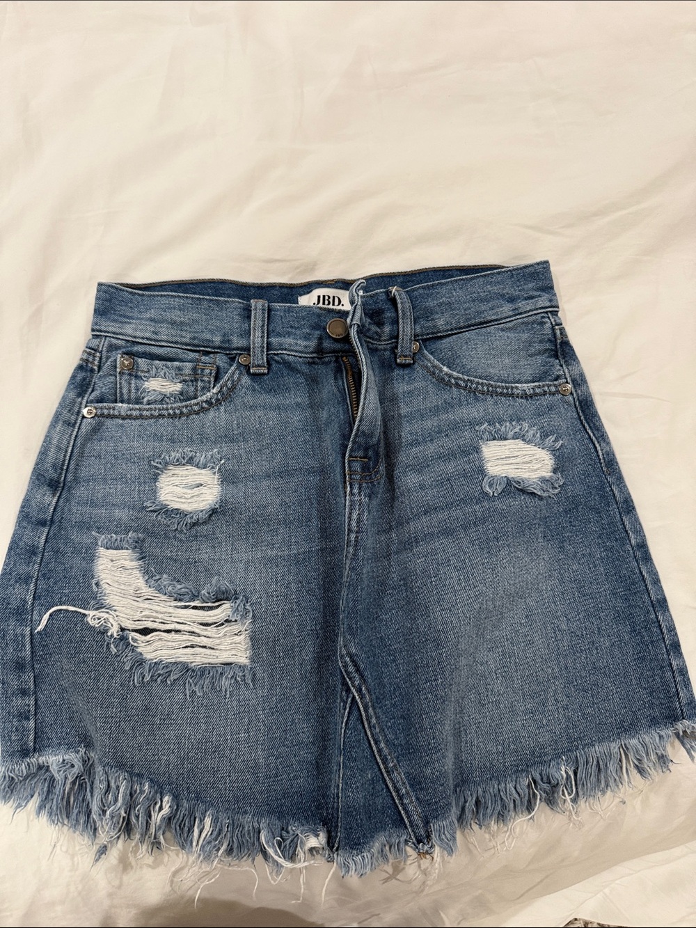 Distressed Denim Mini Skirt in Medium Blue
